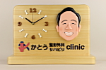 開院祝い：先生の似顔絵入り時計